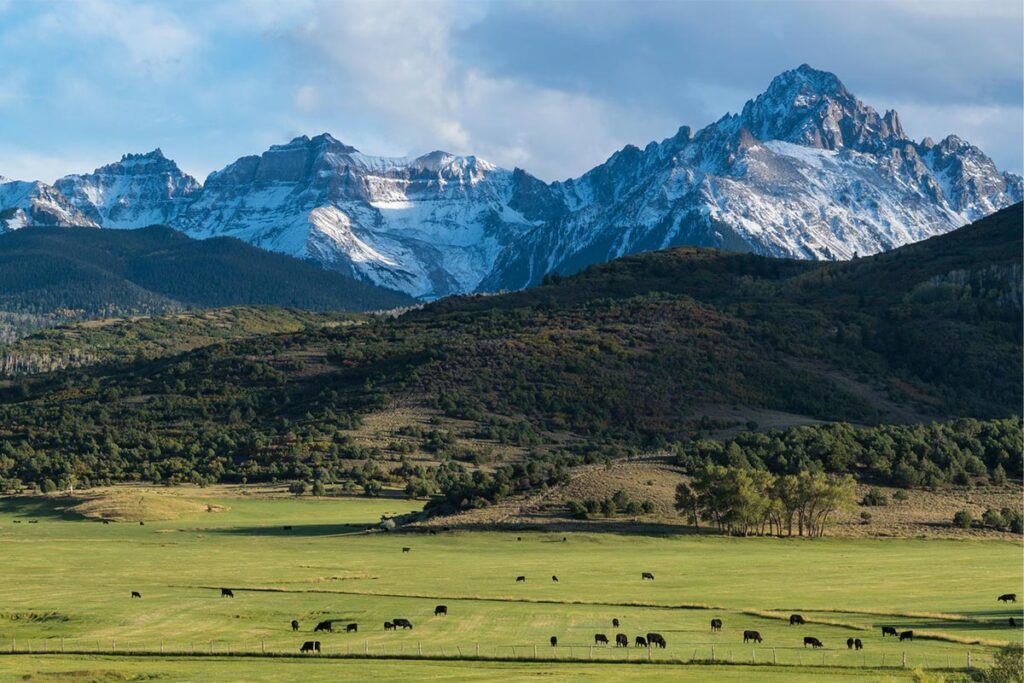 A farm near large mountains in Colorado