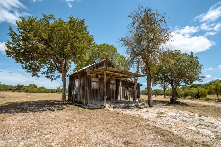 a small shack on a ranch