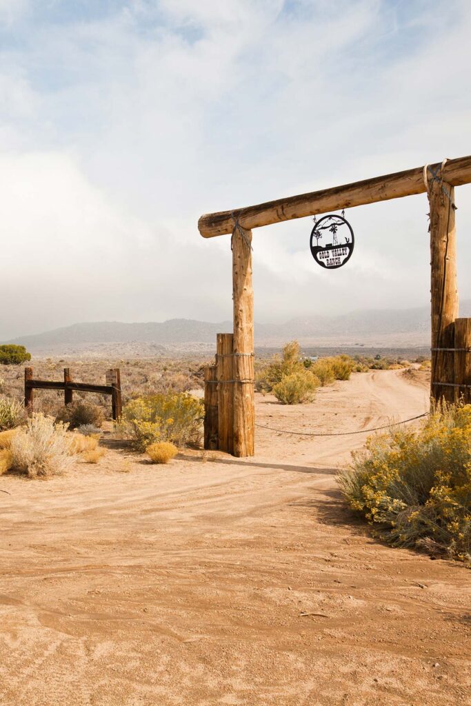 Entrance of a ranch mode of wood poles