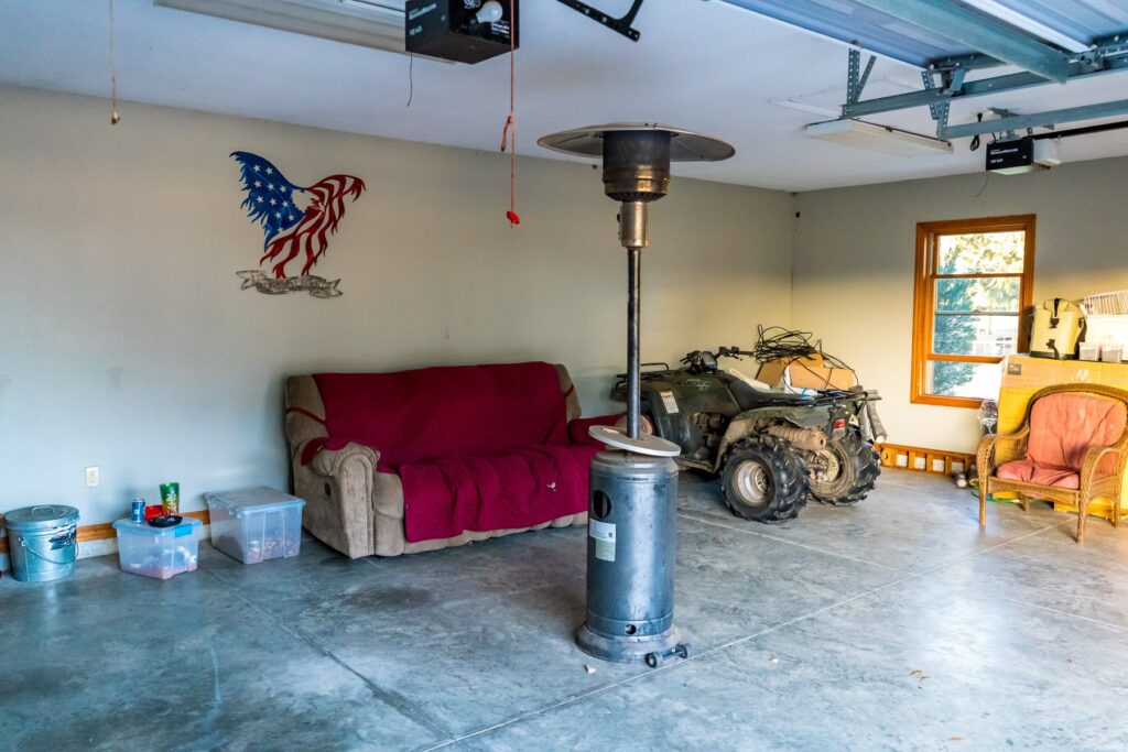 a garage with a heater and a couch