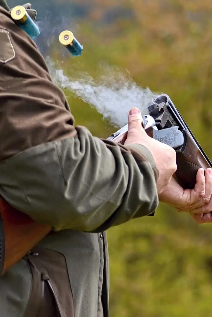 man emptying shotgun
